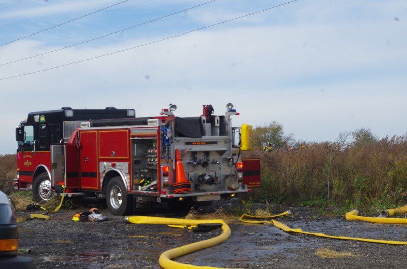 Wind spreads brush fire on Robinson Road